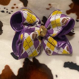Purple and gold football bow.